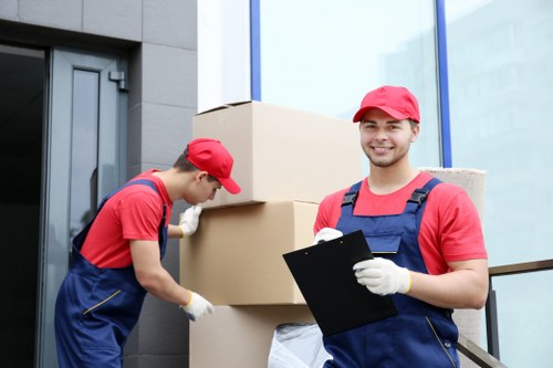 Professional house removals service in Edgware loading furniture into a van
