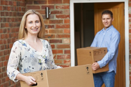 Family using mobile self storage during a house move in Edgware