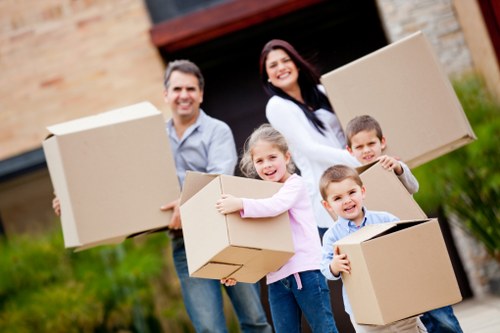 Moving team handling furniture in a residential property in Edgware